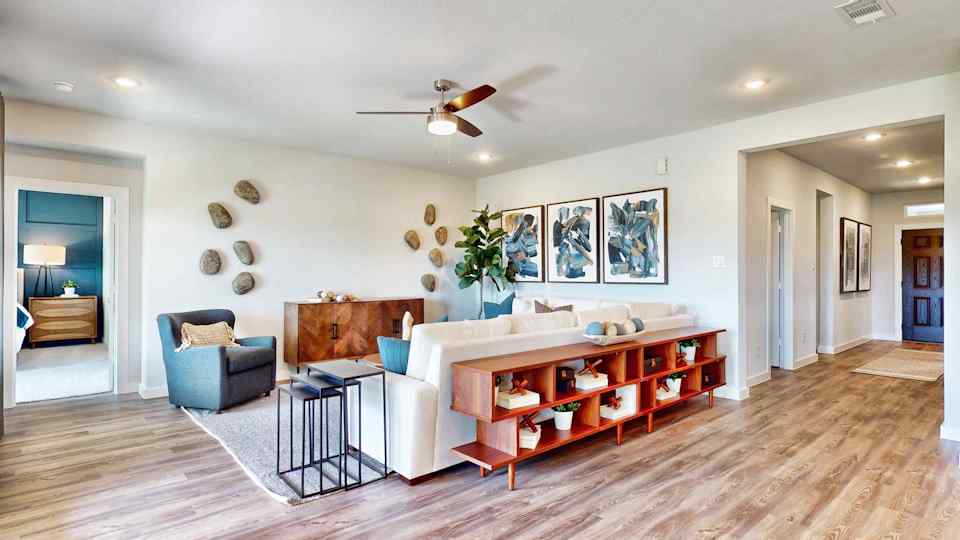 A living room with a wood floor.