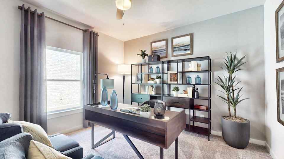 A room with a table and shelves.