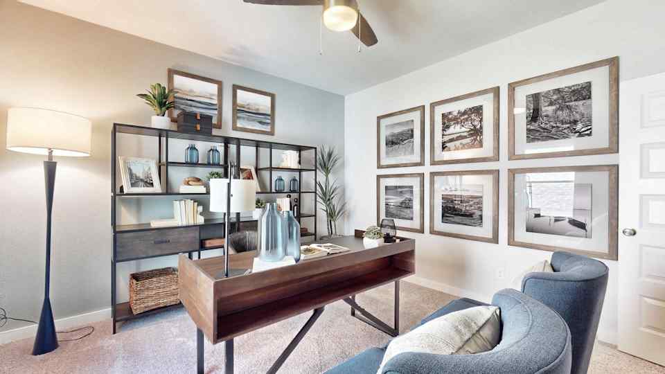 A room with a table and chairs.