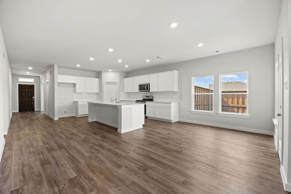 A large kitchen with white cabinets.