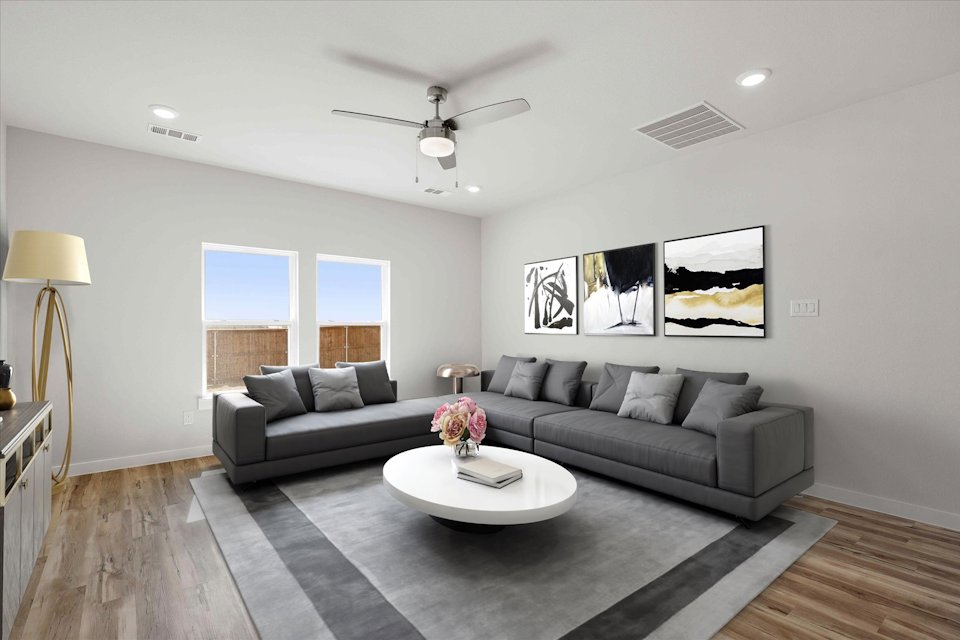 A living room with a couch and a table.