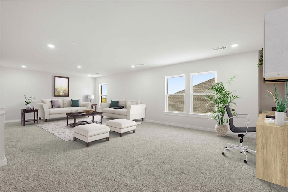 A large living room with a couch and chairs.