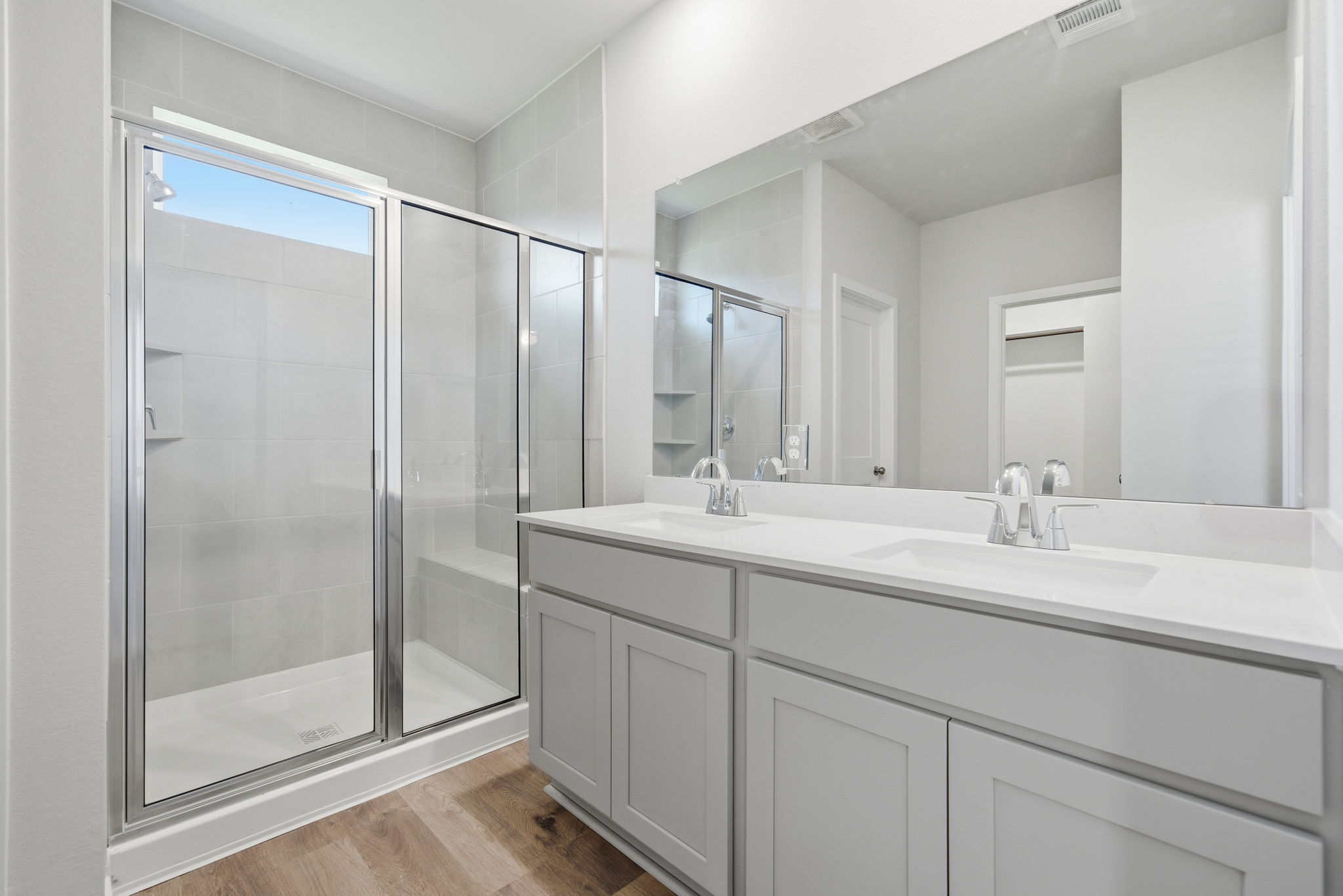 A bathroom with a glass shower.