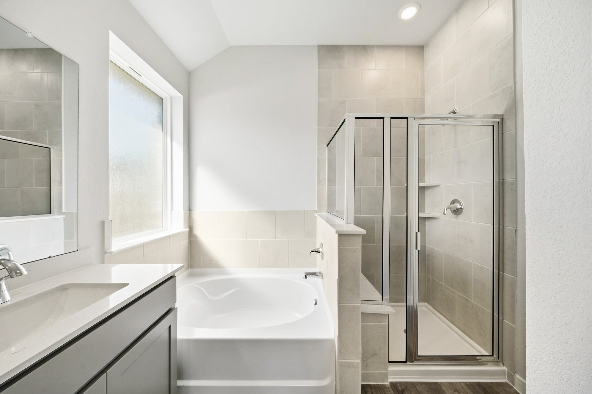 A bathroom with a glass shower.