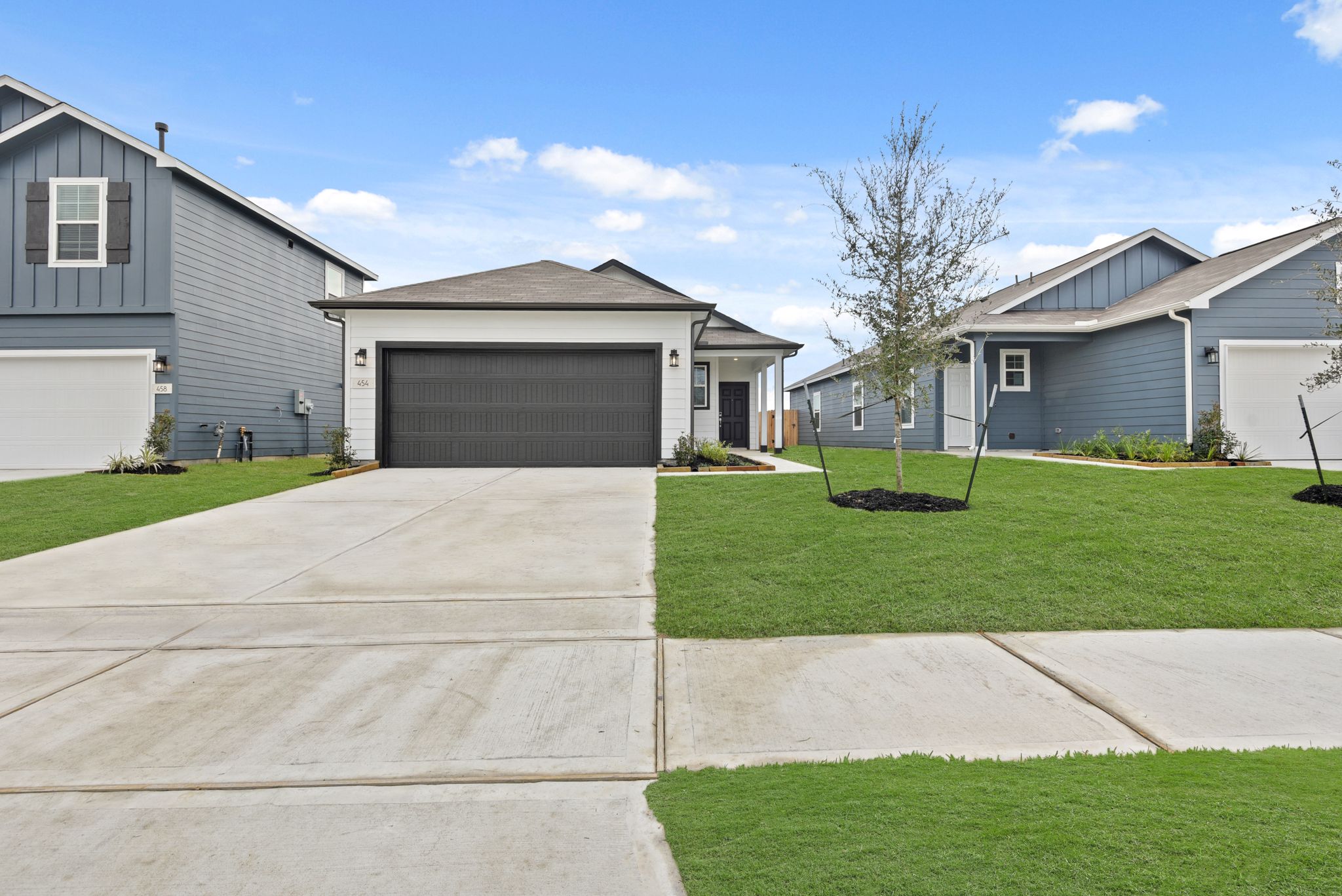 A driveway leading to a house.