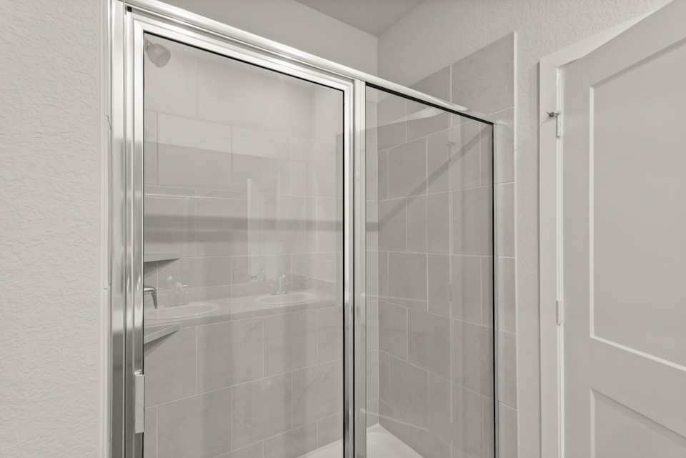 A shower unit in a bathroom.