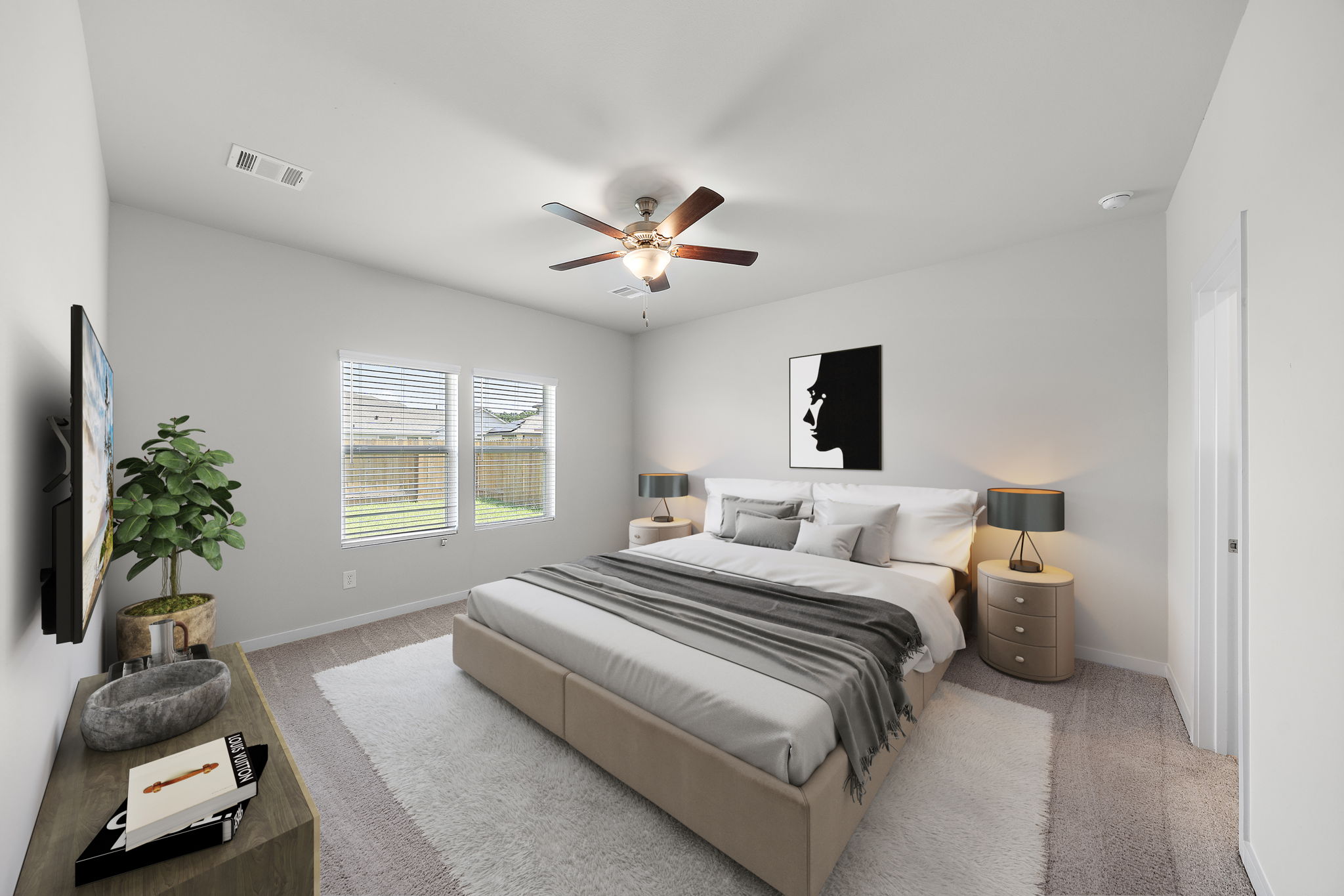 A bedroom with a bed and a fan.