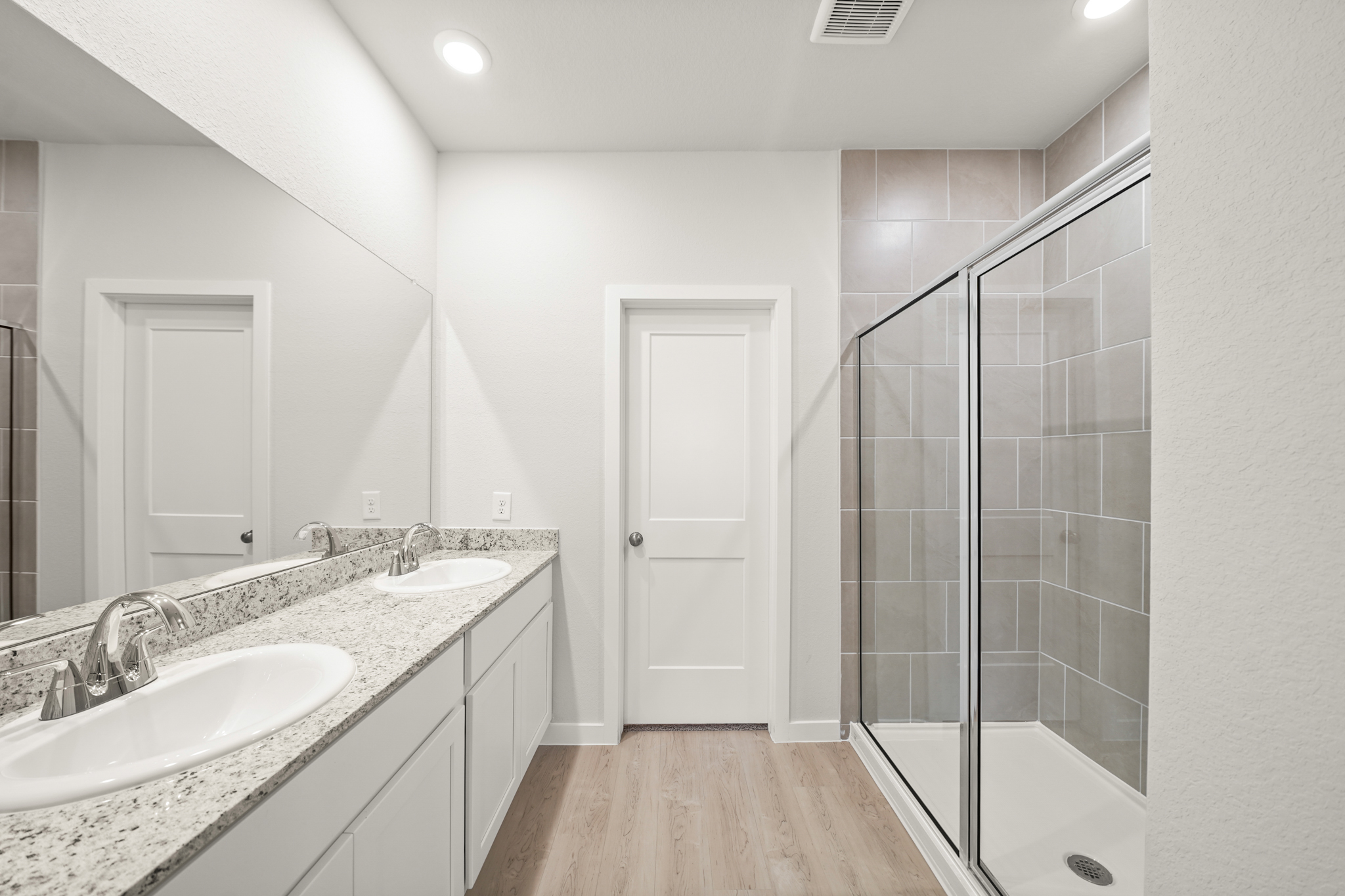 A bathroom with a glass shower.