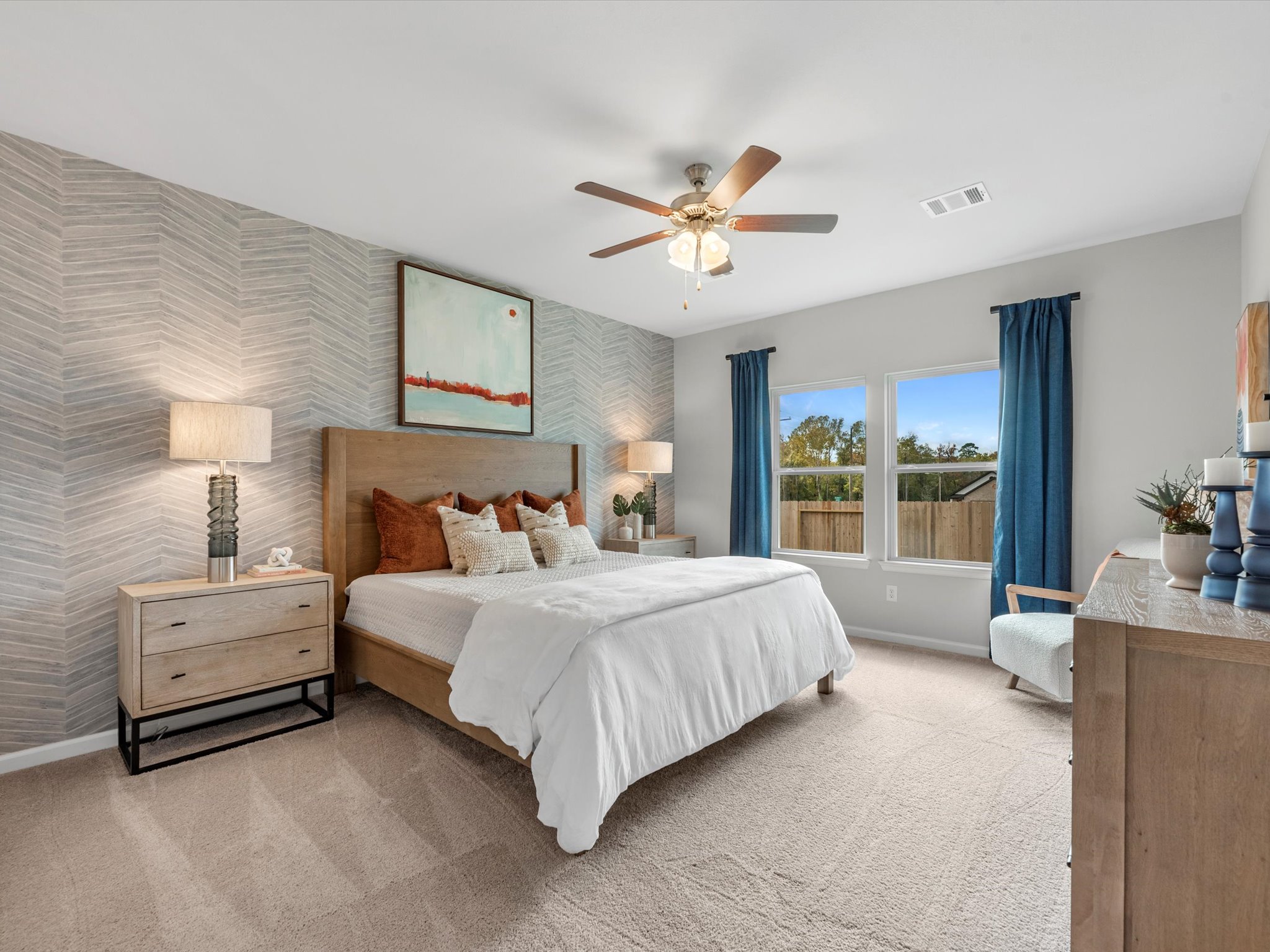 A bedroom with a large bed.