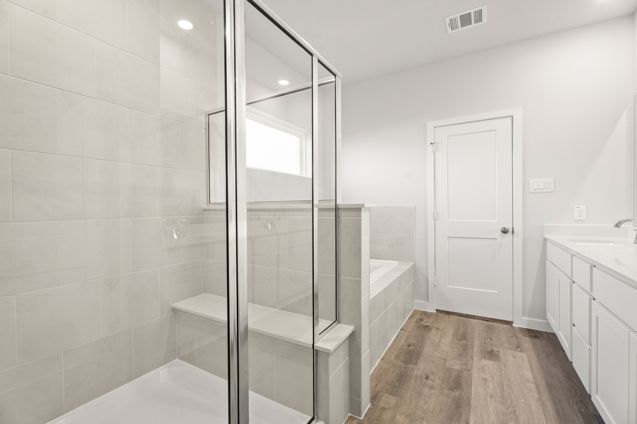 A bathroom with a glass shower.