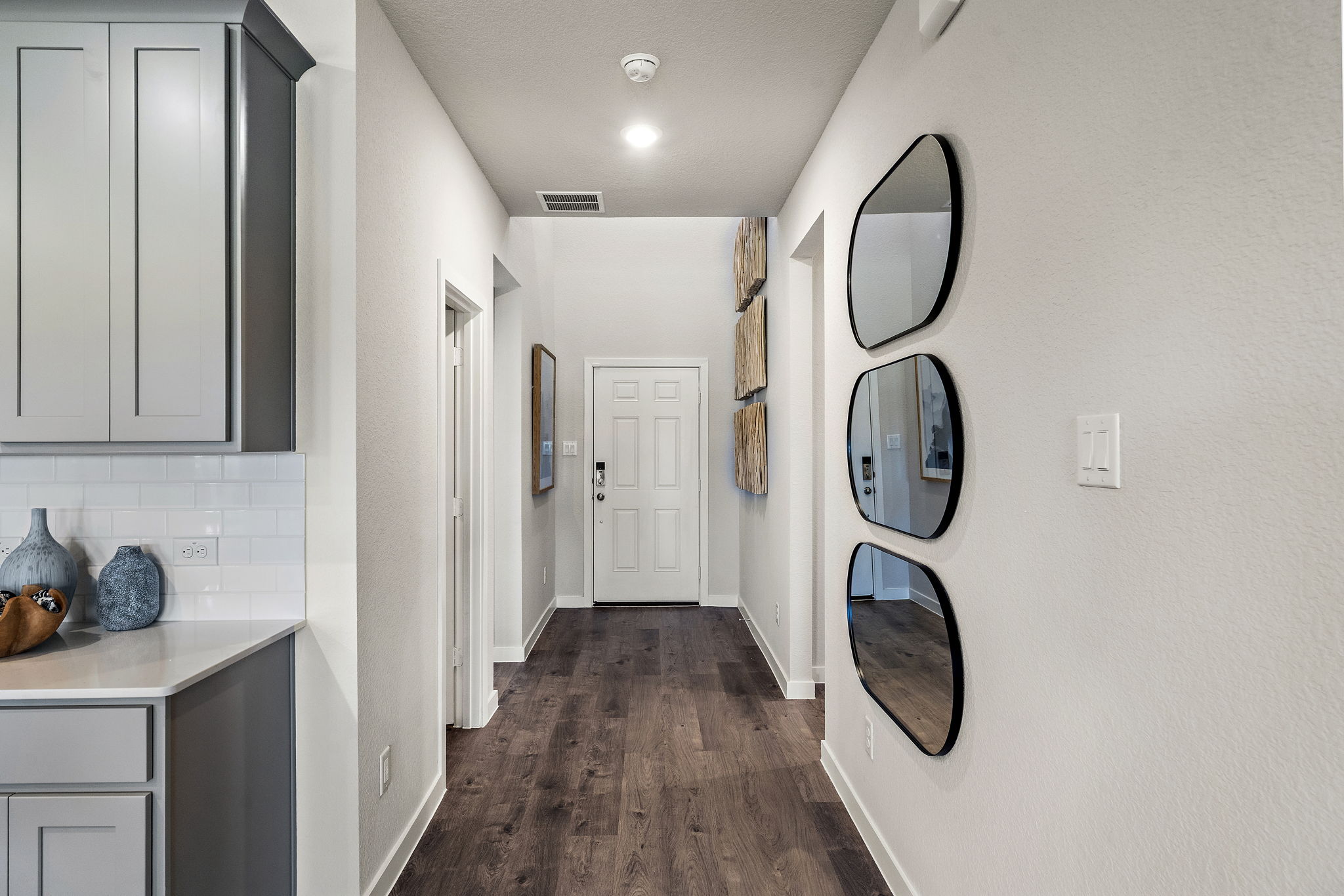 A bathroom with a mirror and sinks.