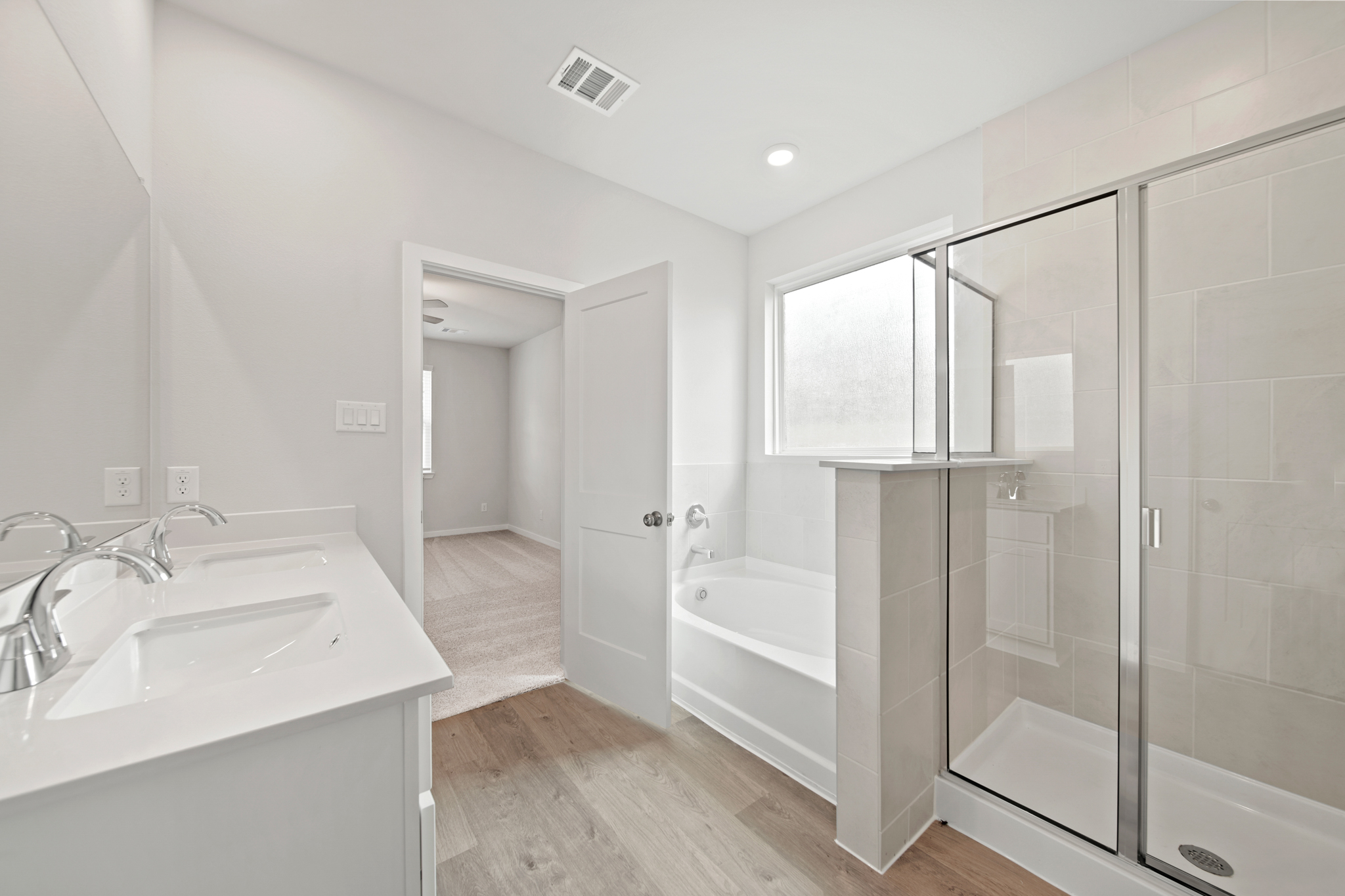 A bathroom with a glass shower.