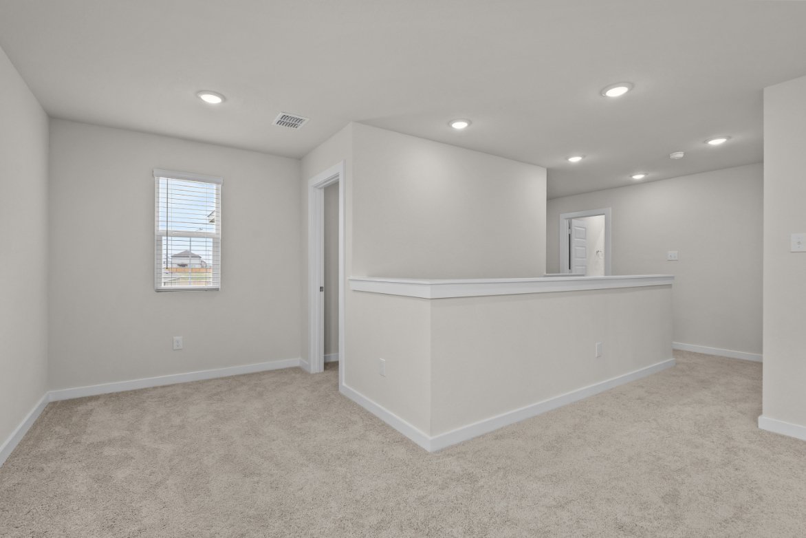 A room with a white counter and a white cabinet.