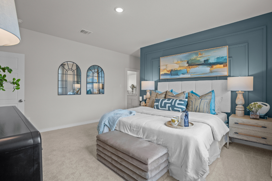 A bedroom with a bed and a couch.