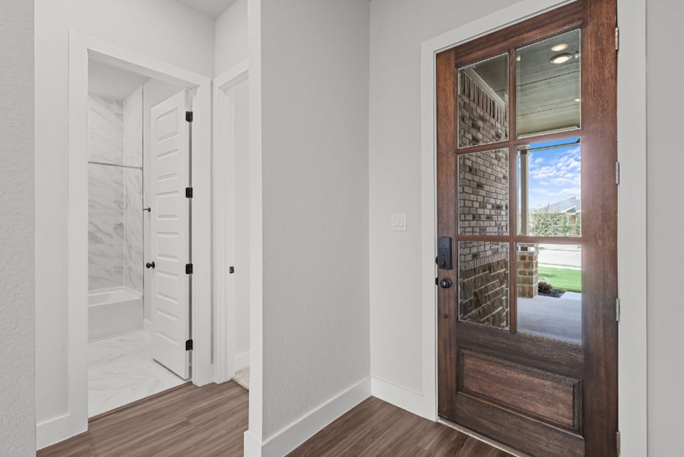 A room with a glass door.