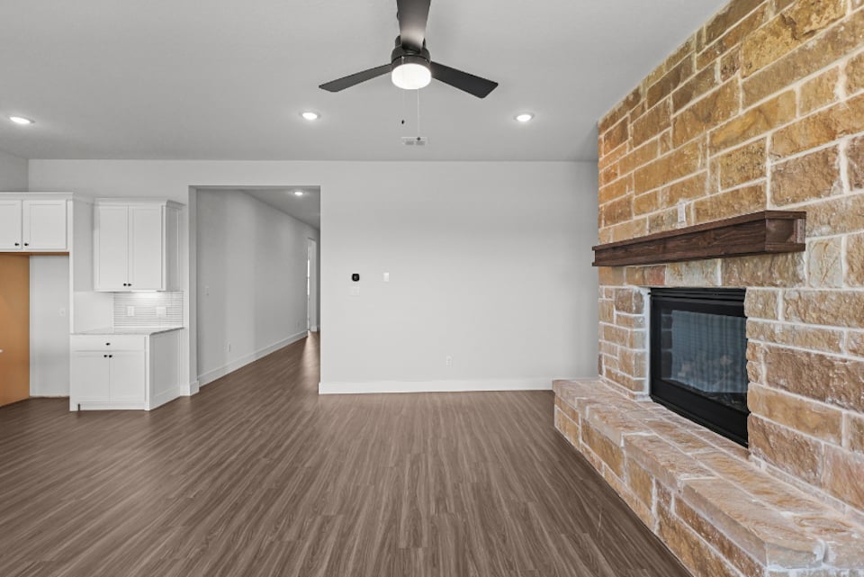 A large kitchen with a fireplace.