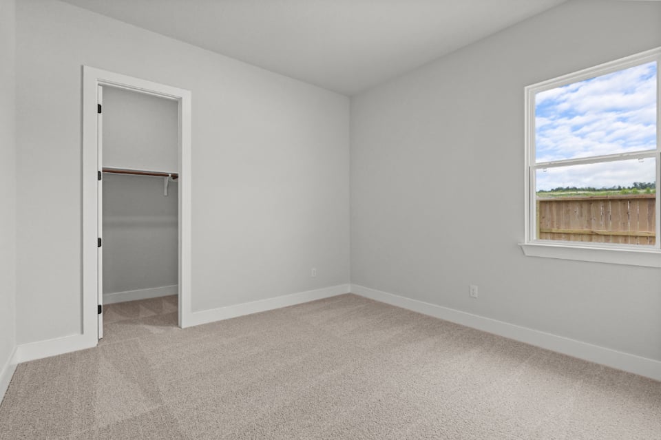 A room with a window and a door.