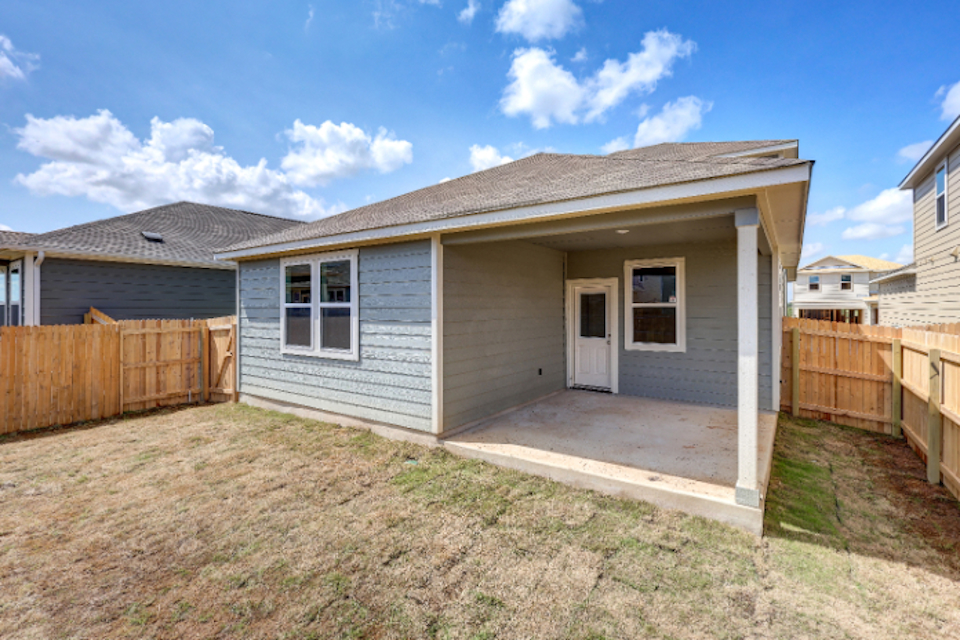 A house with a fence around it.