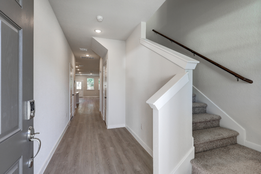 A hallway with white walls.