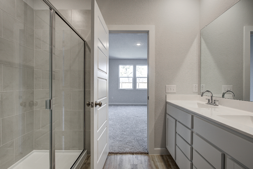 A bathroom with a glass shower.