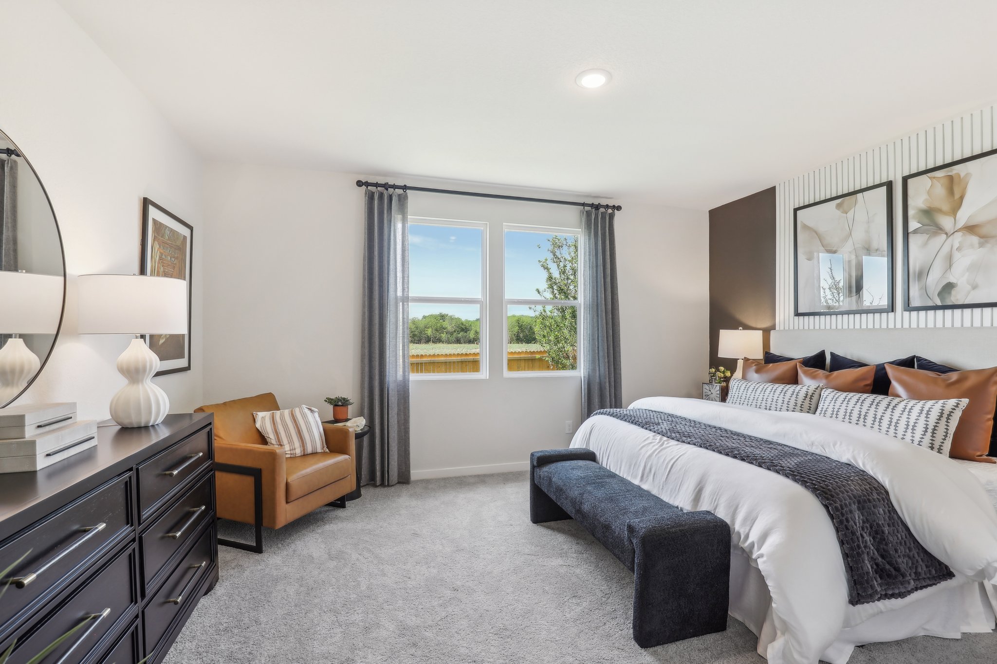 A bedroom with a bed and a desk.