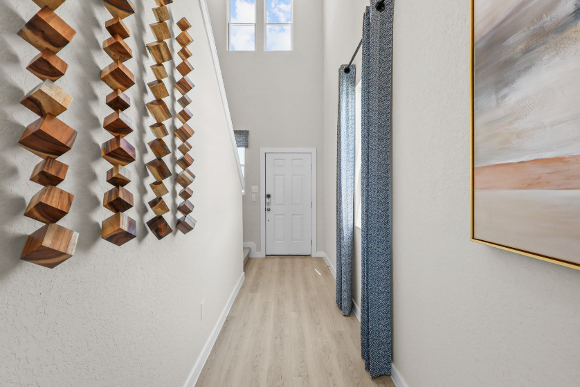 A hallway with wood shelves.