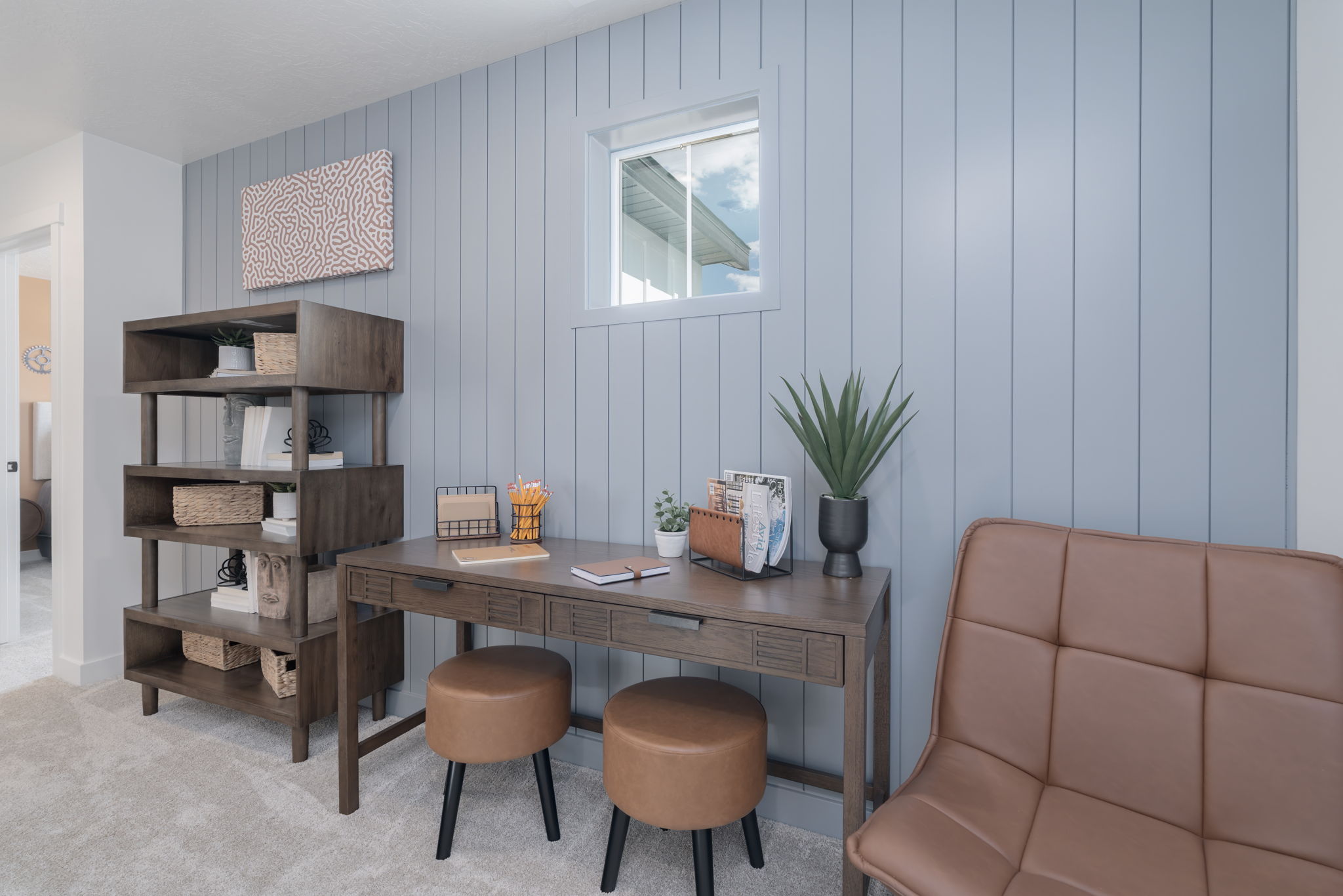 A room with a table and chairs.