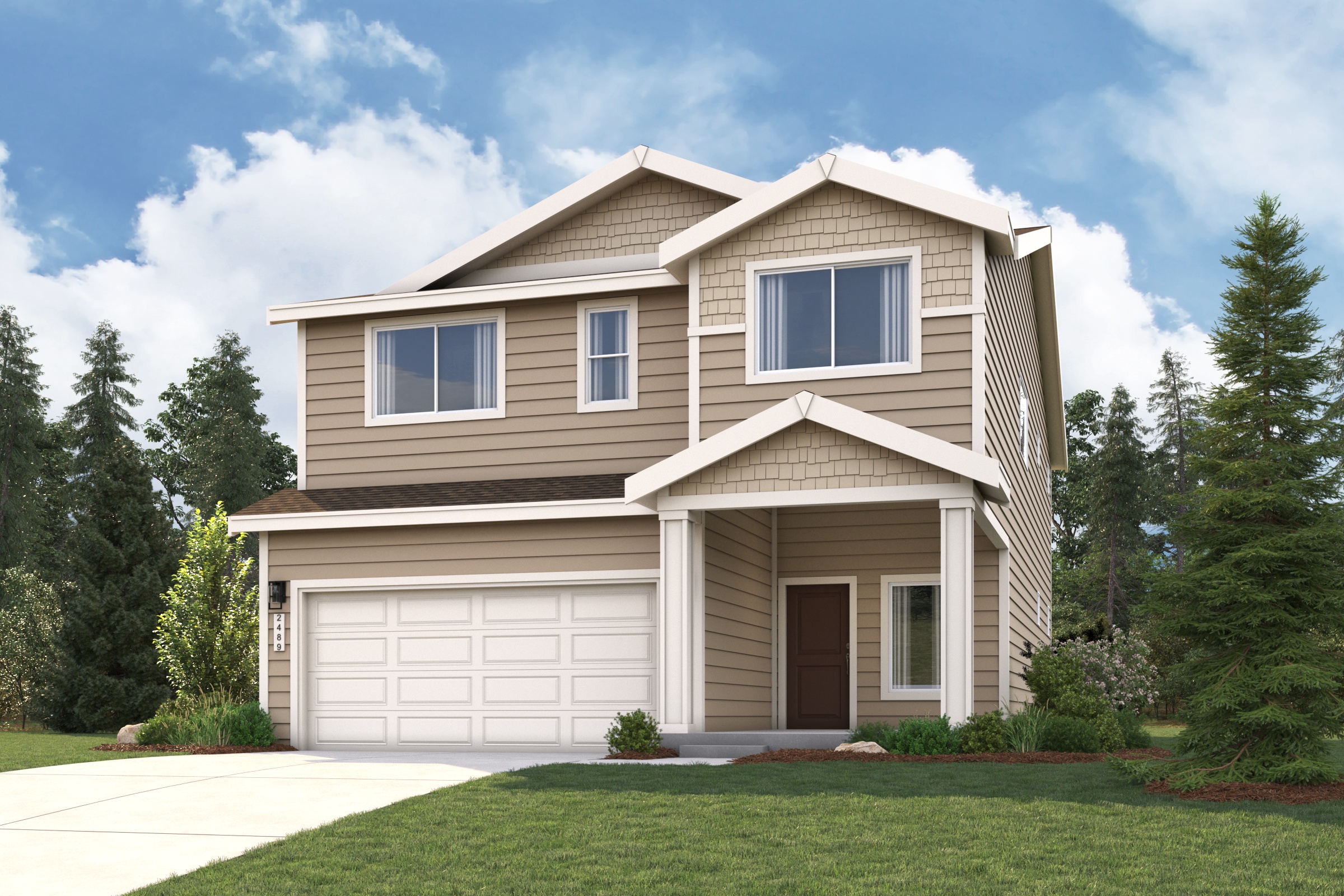 A house with a garage and trees in the back.
