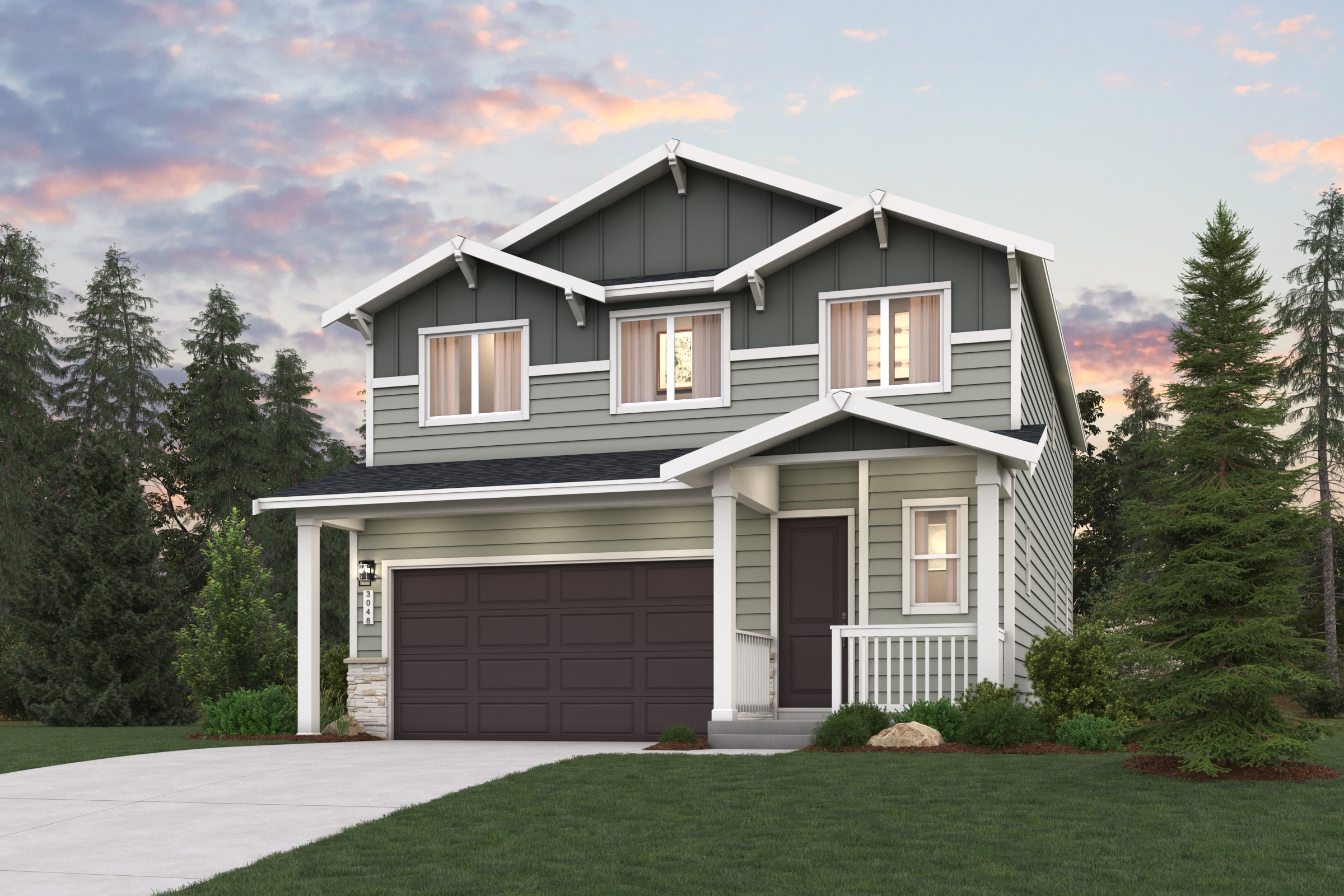 A house with a garage and trees around it.