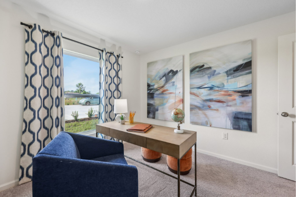 A room with a table and chairs.