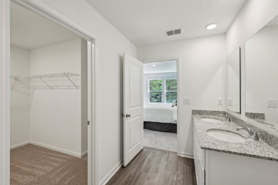 A bathroom with a sink and a bathtub.