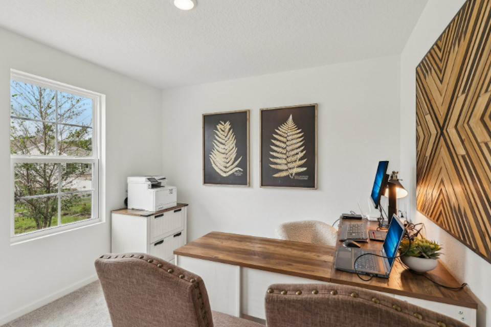 A room with a table and chairs.