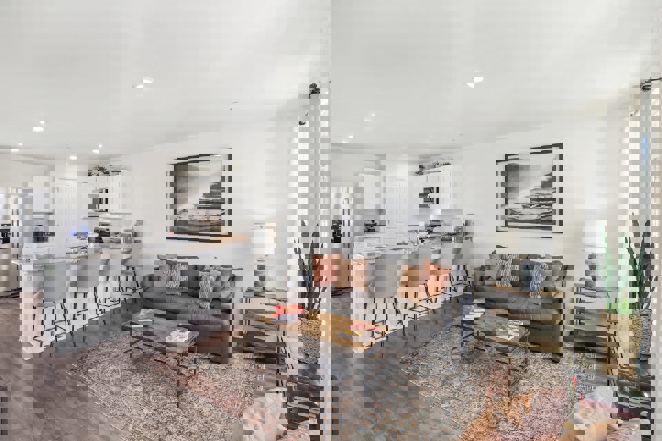 A living room with a couch and a table.