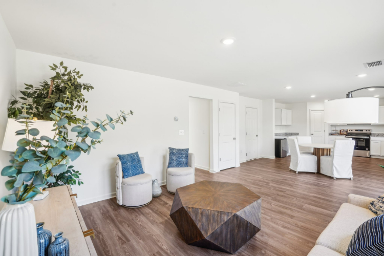 A living room with white walls.