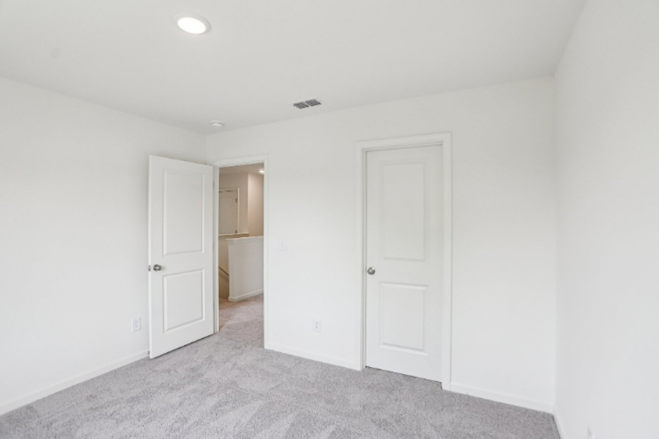 A room with white doors.