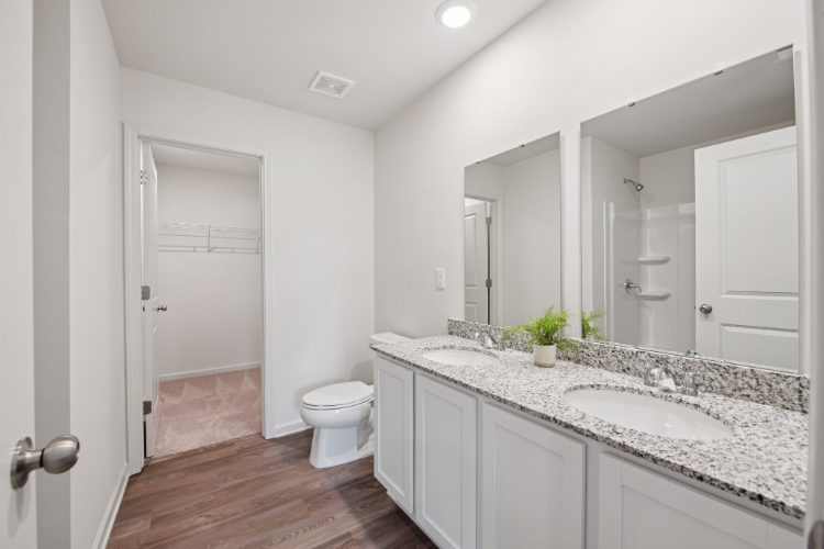 A bathroom with a marble countertop.