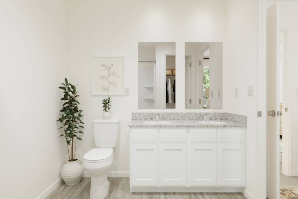 A bathroom with a marble countertop.