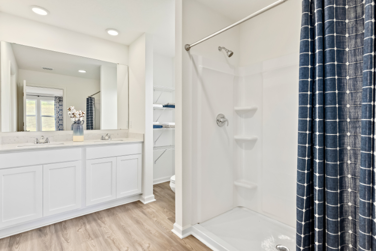 A bathroom with a shower and a bathtub.