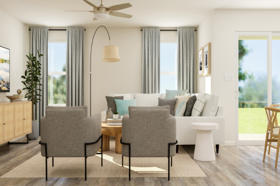 A living room with a couch and chairs.