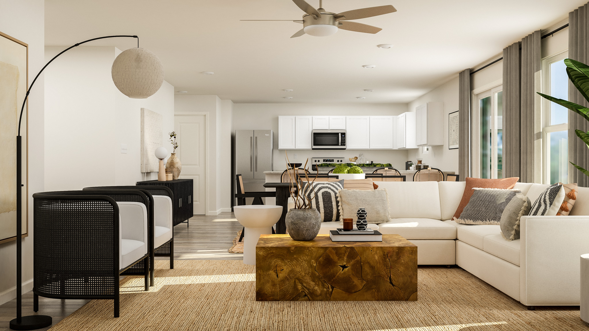 A living room with a white couch and a table.