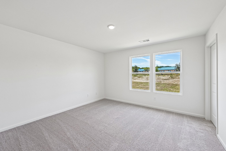 A room with a window and a door.
