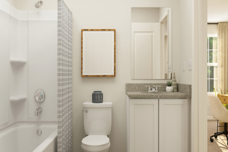 A bathroom with a sink toilet and bathtub.