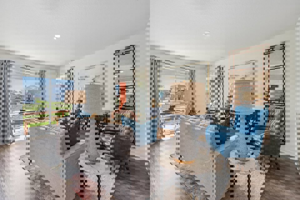 A living room with a couch and a table.