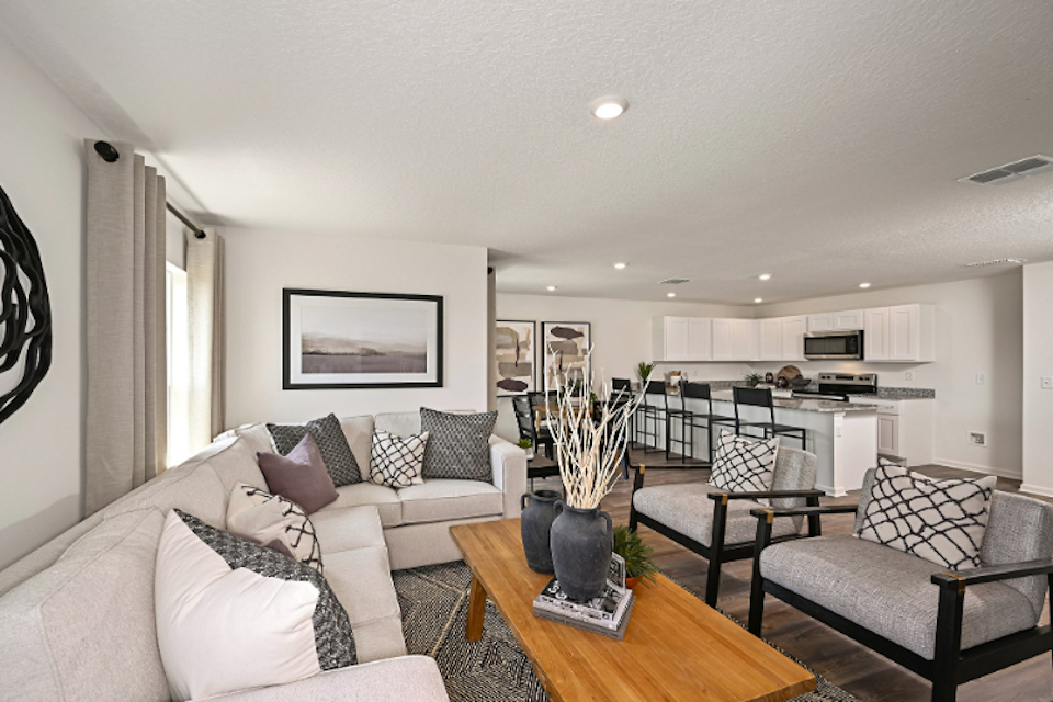A living room with a couch and a table.