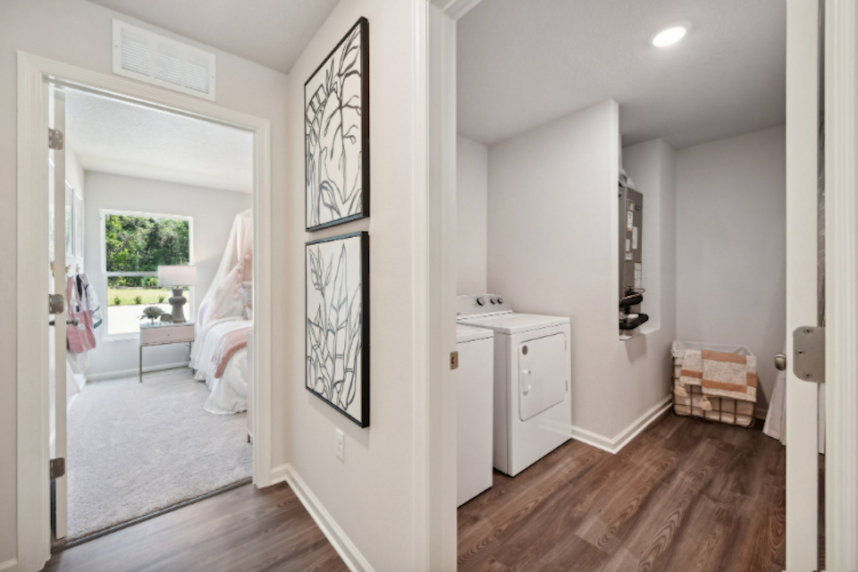 A room with a bed and a desk.