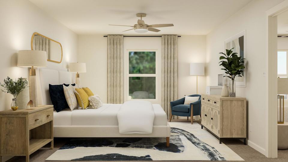 A living room with a couch and a table.