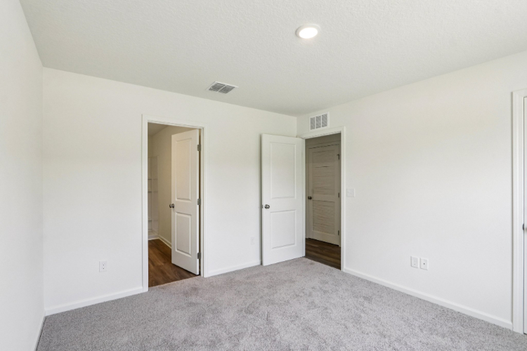 A hallway with white walls.