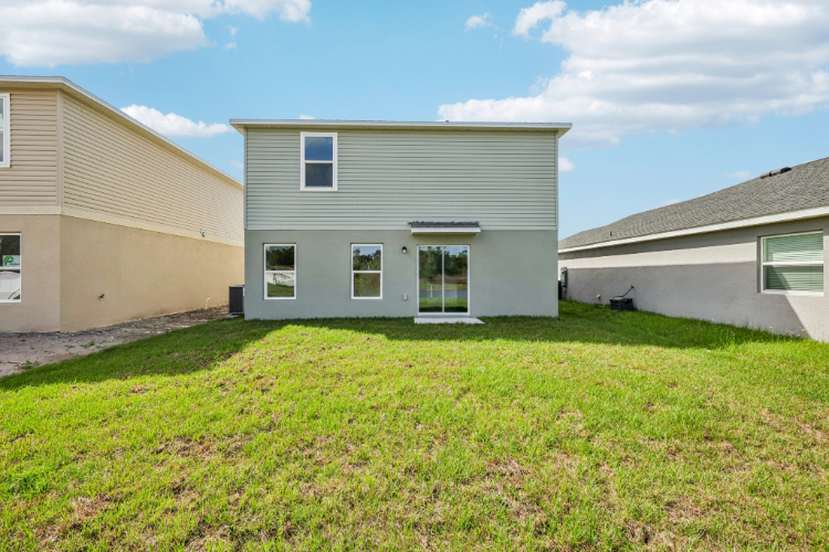 A house with a grass yard.