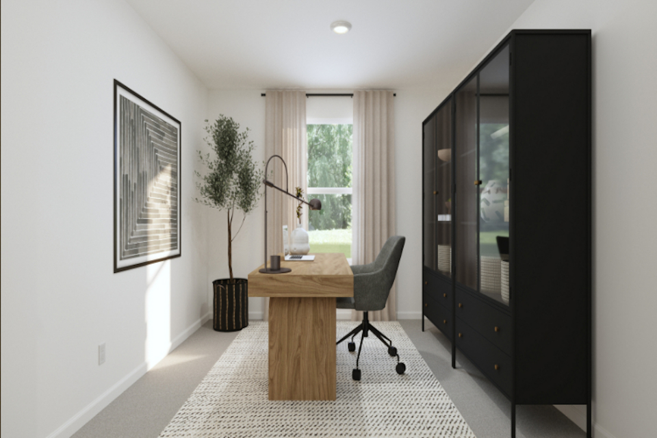 A room with a desk and a chair.