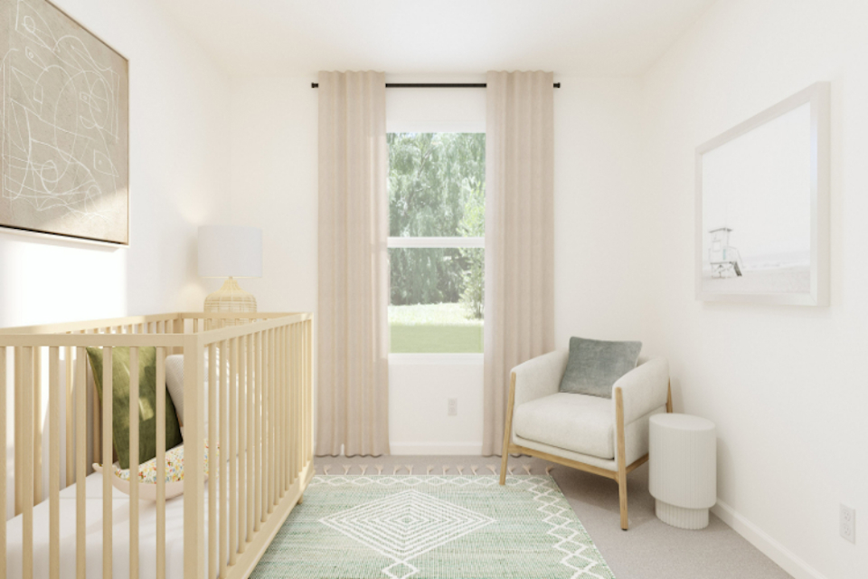 A room with a chair and a window.